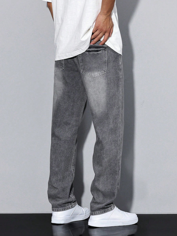 Gray washed wide-fit jeans from the back showing patch back pockets.