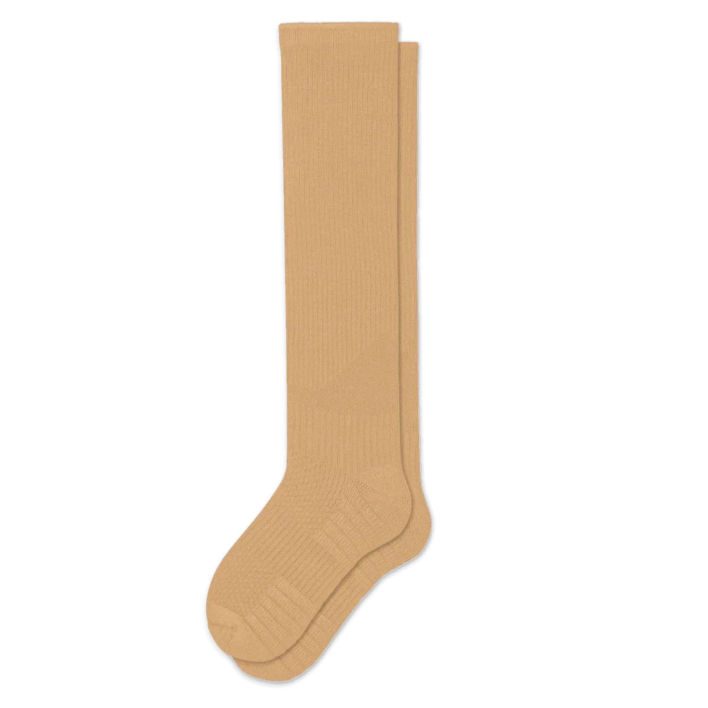 Pair of tan knee-high ribbed socks laid flat on white, showing the cushioned heel and toe panels. 5