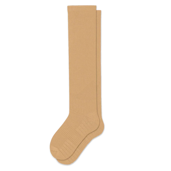 Pair of tan knee-high ribbed socks laid flat on white, showing the cushioned heel and toe panels. 5