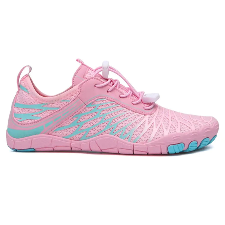 Right-side view of the pink barefoot shoe showing turquoise overlays, elastic laces with a white toggle and the roomy toe area.