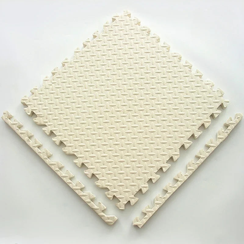 Single cream foam puzzle tile with a textured surface and two detached edge strips.