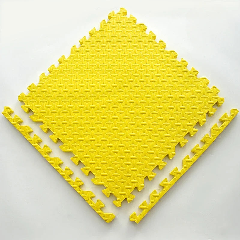 Single yellow foam puzzle tile with a textured leaf pattern and two detached border strips.