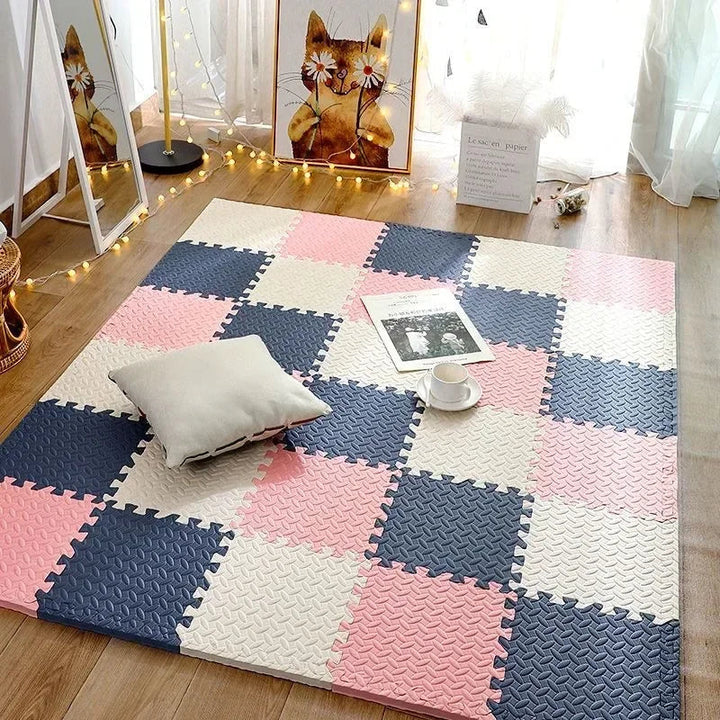 Pink, navy and cream foam puzzle mat laid in a room with fairy lights.