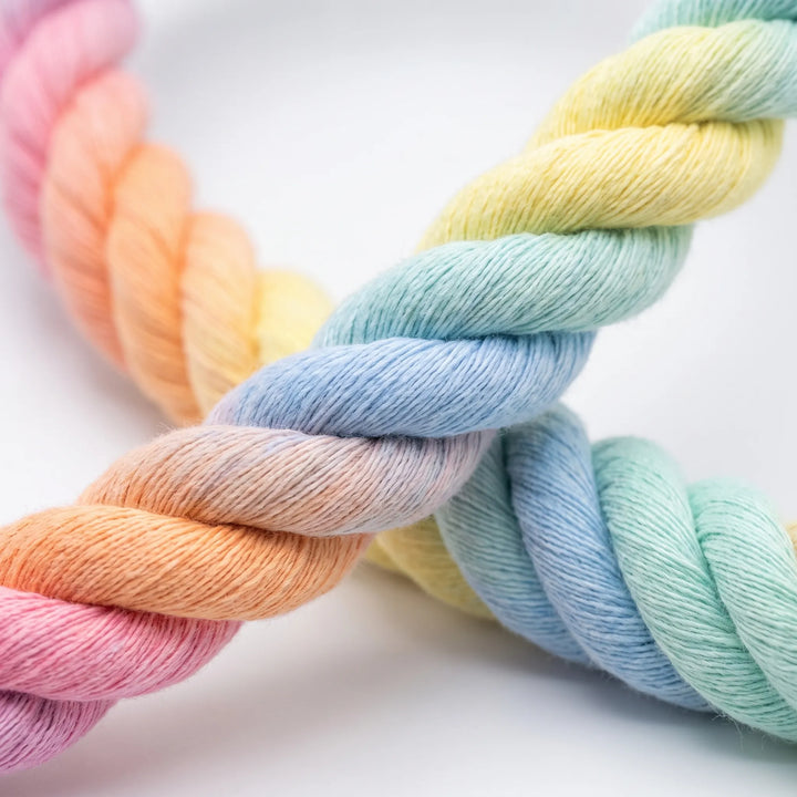 Close-up of the thick twisted rope strands, showing the soft fibers and the gradual blend of pastel pink, orange, yellow, blue and mint. 3