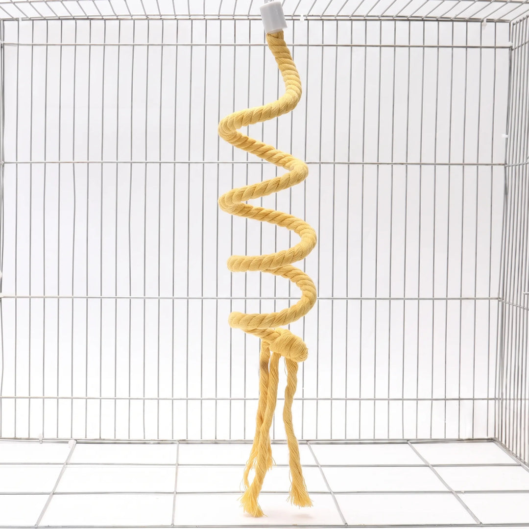 Yellow twisted cotton rope perch coiled in a spiral, hanging inside an empty wire cage with frayed tassels at the bottom. 1