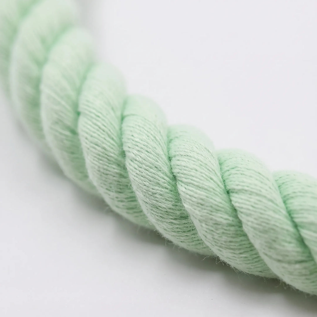 Close-up of the mint green twisted cotton rope, showing the soft braided strands and fine fibers of the texture. 3