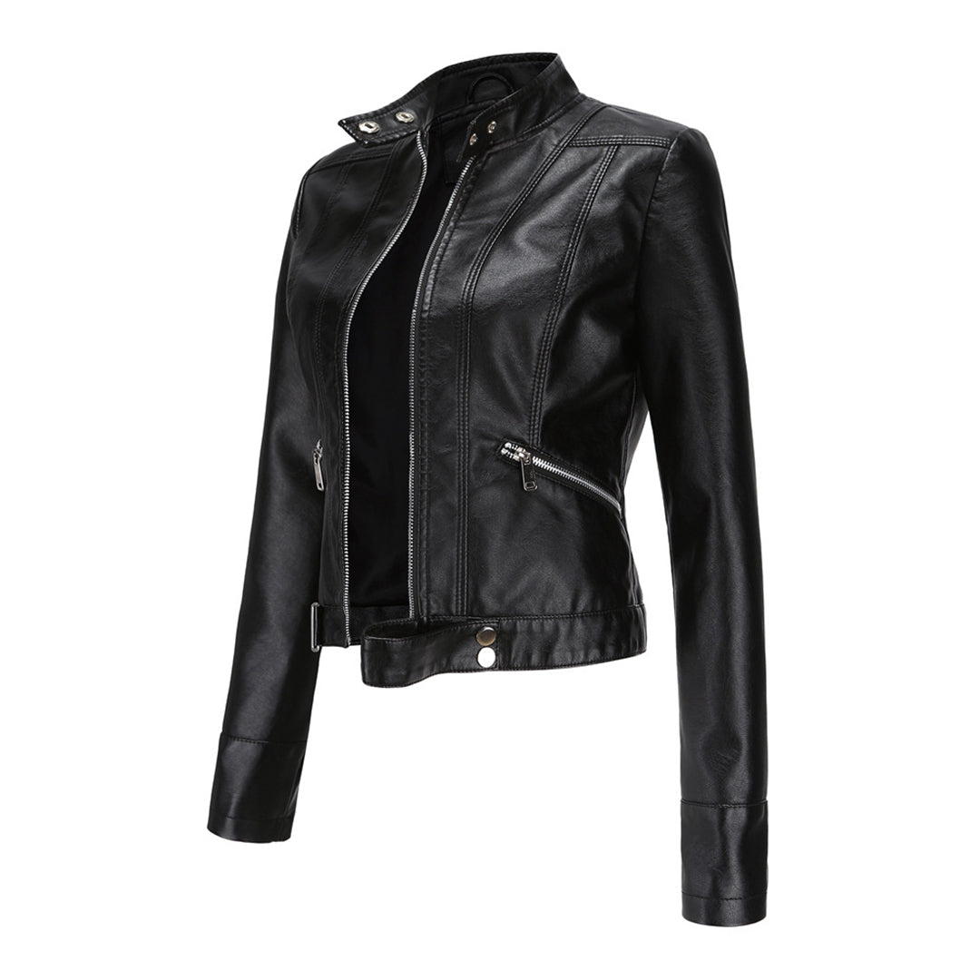 Black cropped jacket turned at a three-quarter angle, open at the front, showing angled zip pocket and snap waist tab. 9