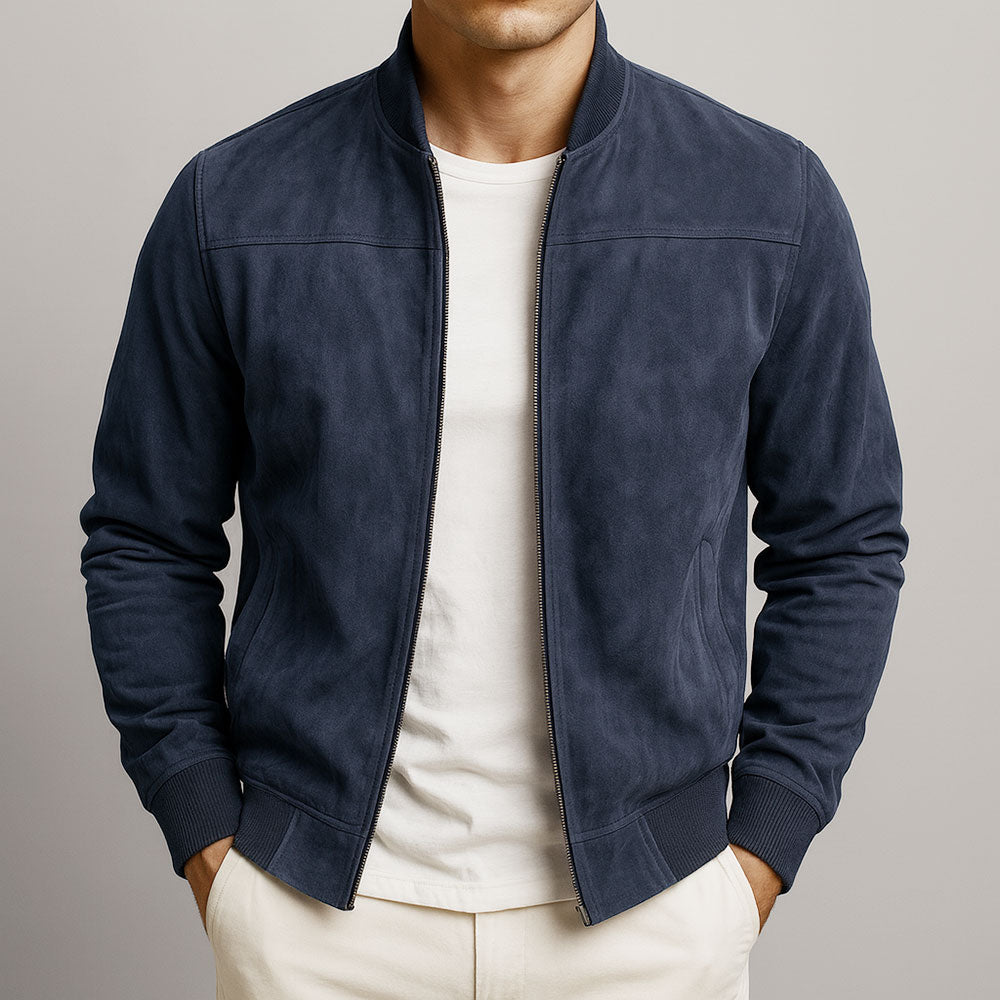Men's bomber jacket in navy blue, another view, worn open over a white tee and cream pants.