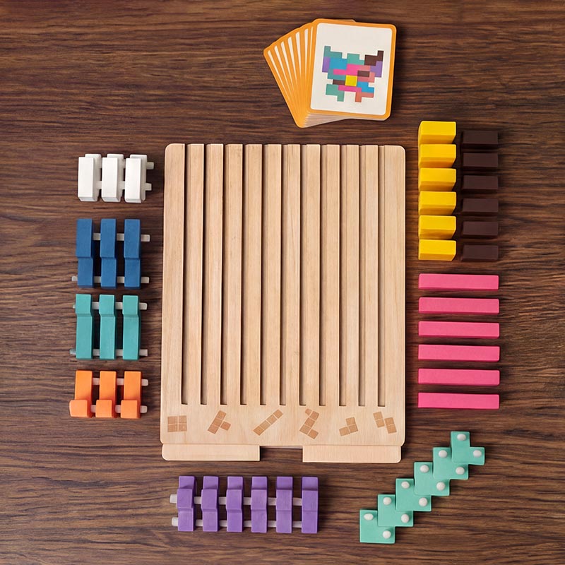 Flat lay of the empty slotted board surrounded by blocks sorted by color, with a fan of task cards at the top. 10