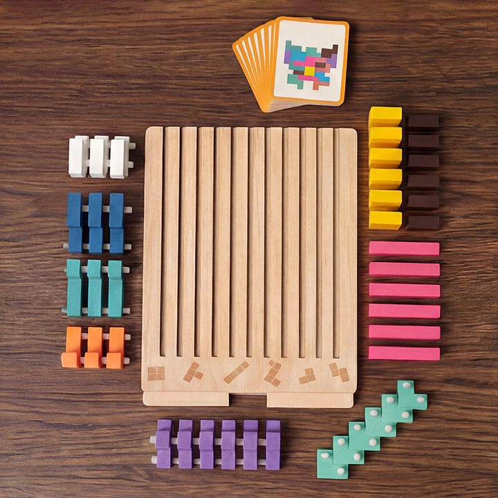 Flat lay of the empty slotted board surrounded by blocks sorted by color, with a fan of task cards at the top. 10