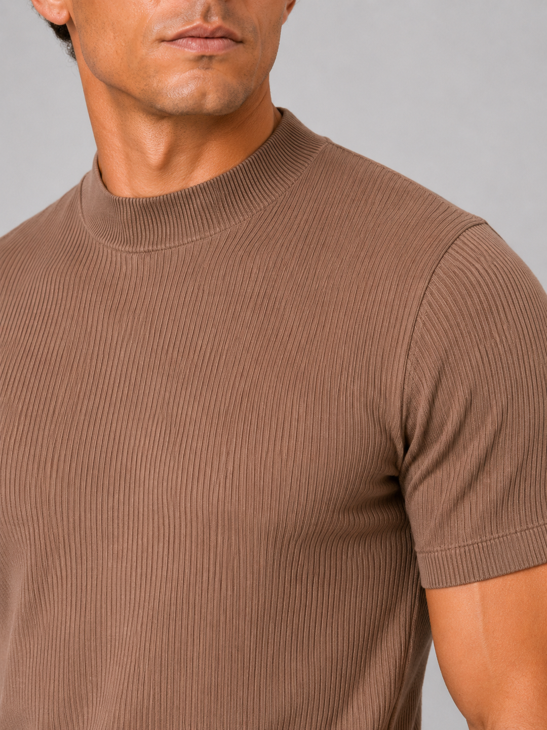 Brown ribbed knit texture, mock neck collar and short sleeve cuff on a men's tee.
