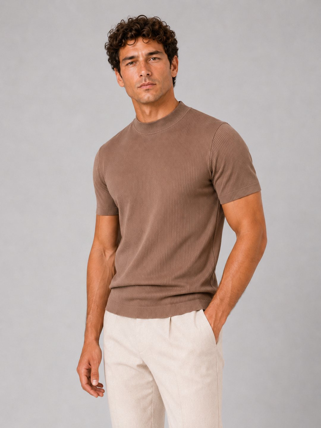 Men's brown ribbed mock neck tee with short sleeves, shown three-quarter front against a gray studio backdrop.