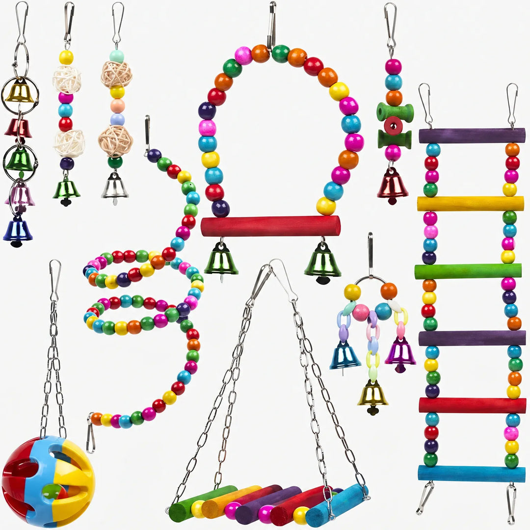 Flat lay of ten hanging bird toys on white: bead swing, spiral, ladder, rattan balls, bell strings and a perforated ball. 1