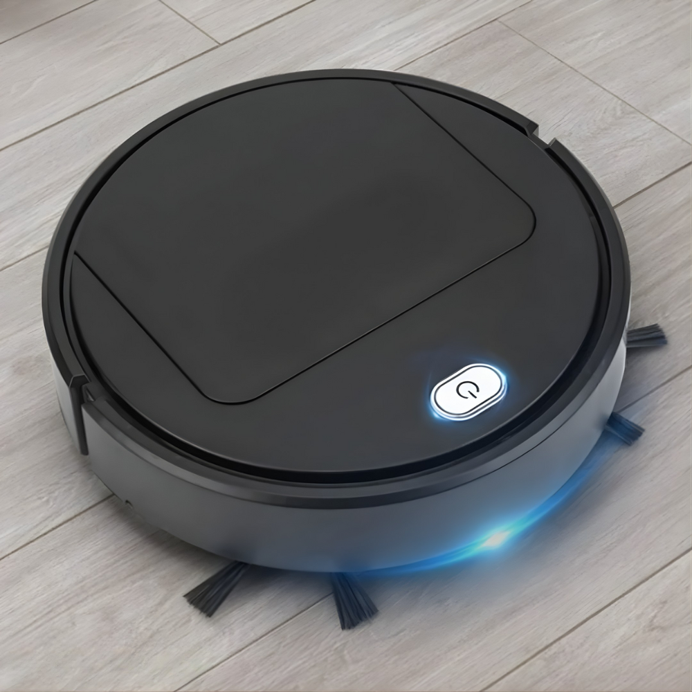 Black round robot vacuum on a light wood floor, with a glowing power button and blue light strip 2