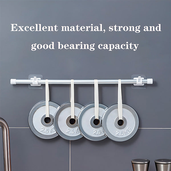 Storage hooks holding four weight plates on a wall.