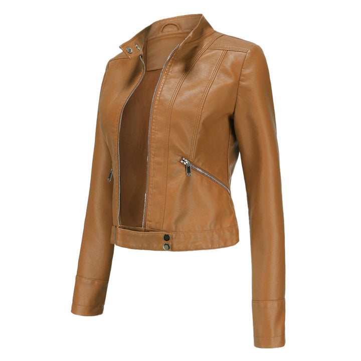 Tan camel-colored cropped jacket in three-quarter view, open at the front, showing zippered pocket and snap waist tab. 12