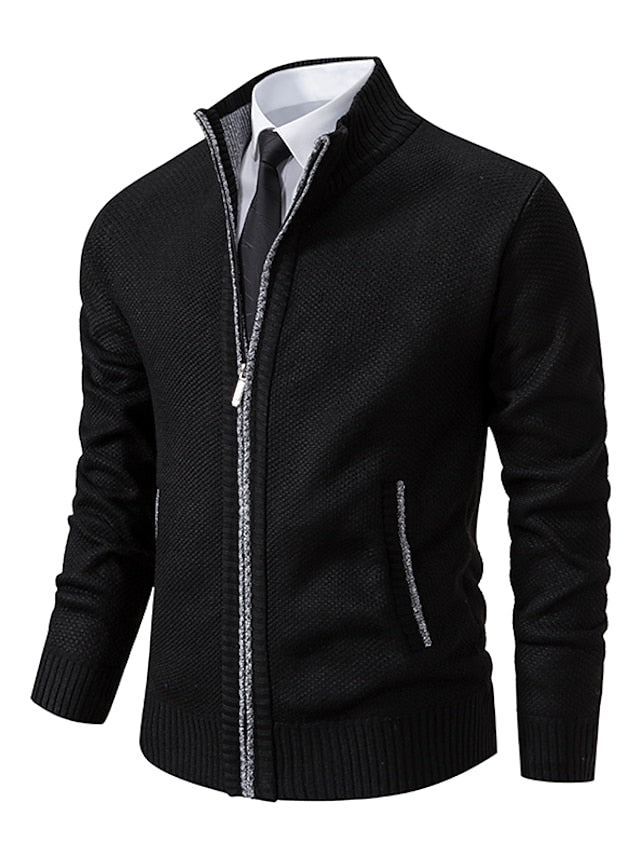 Black knit zip-up cardigan with gray contrast trim along the zipper and pockets, worn over a shirt and tie.