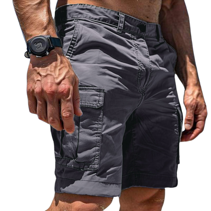 Men's Cargo Shorts in dark gray with a large flap side pocket, belt loops and button waist, shown at an angle.