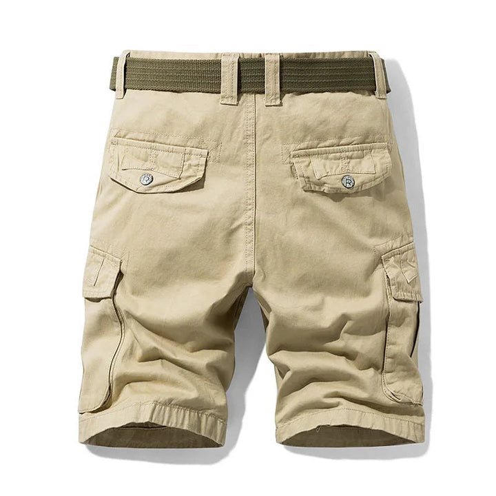 Back view of khaki cargo shorts with a green belt, two button-flap back pockets and large side cargo pockets.