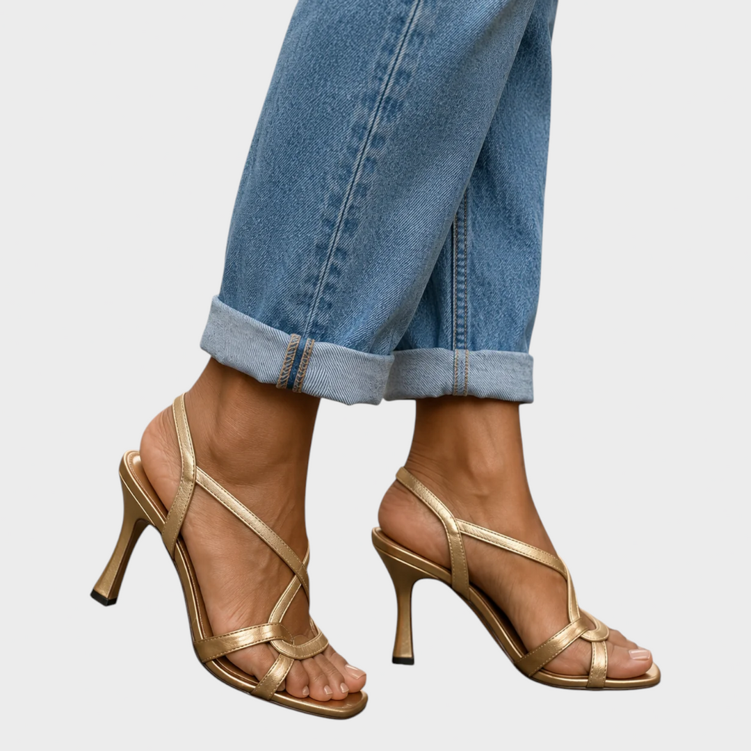 Gold crisscross-strap sandals with flared stiletto heels and ankle slingbacks, another view. 2