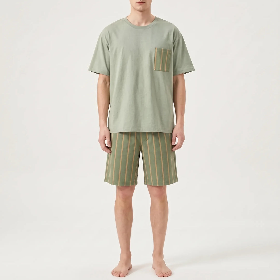 Model wearing the sage green version, a plain tee with a striped pocket and matching striped shorts. 6