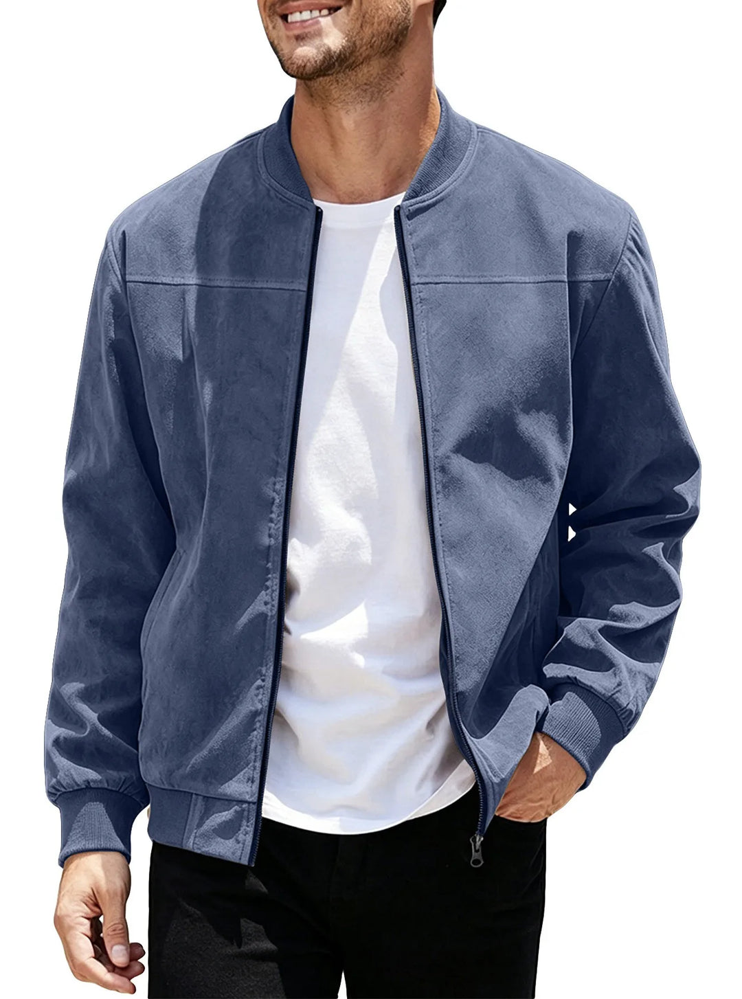 Man wearing the navy blue zip-up jacket open over a white tee, hand in pocket 47