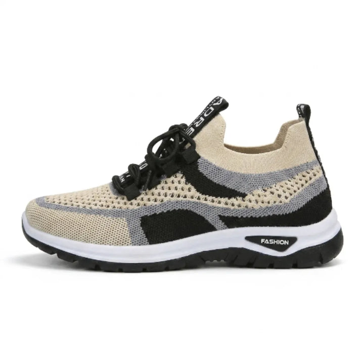 Side view of a beige knit mesh sneaker with gray and black panels, black laces, a white midsole and black outsole. 37
