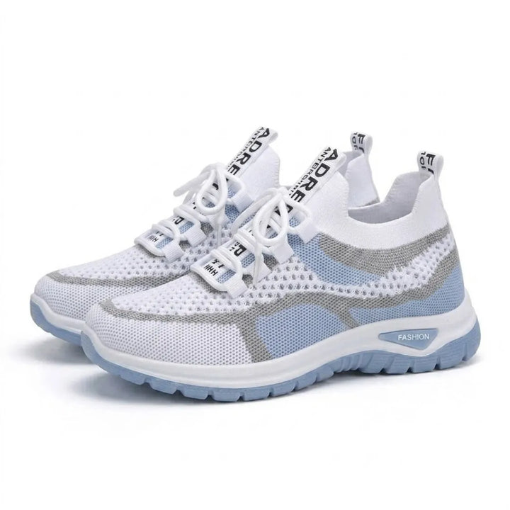 Pair of white and light blue mesh sneakers with white laces, gray trim and a light blue outsole.