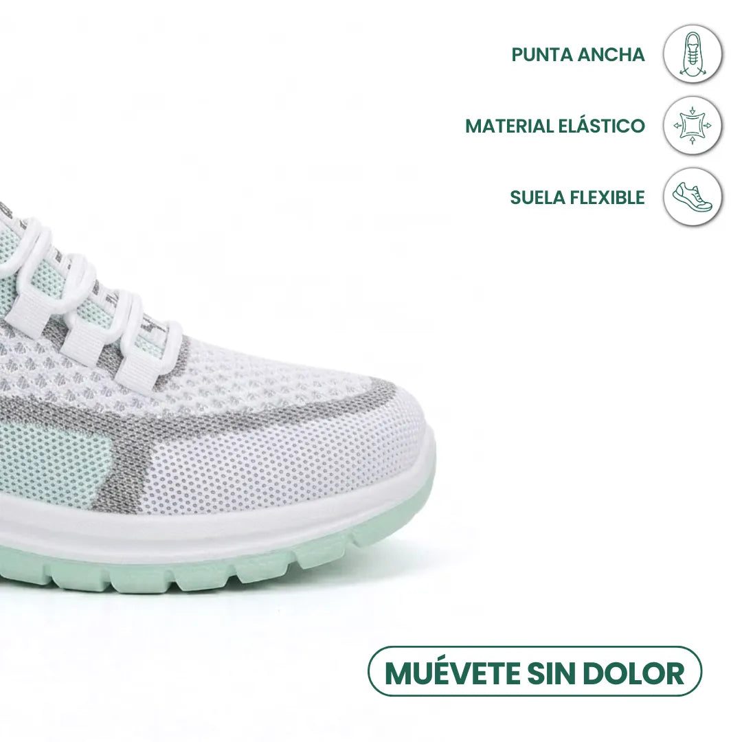 Close-up of the toe box of the mint green sneaker, with icons highlighting a wide toe, stretchy material and flexible sole. 14