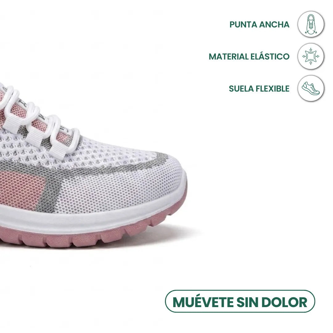 Close-up of the toe box of a white mesh sneaker with pink and gray panels, white laces and a pink rubber sole, with feature icons. 23