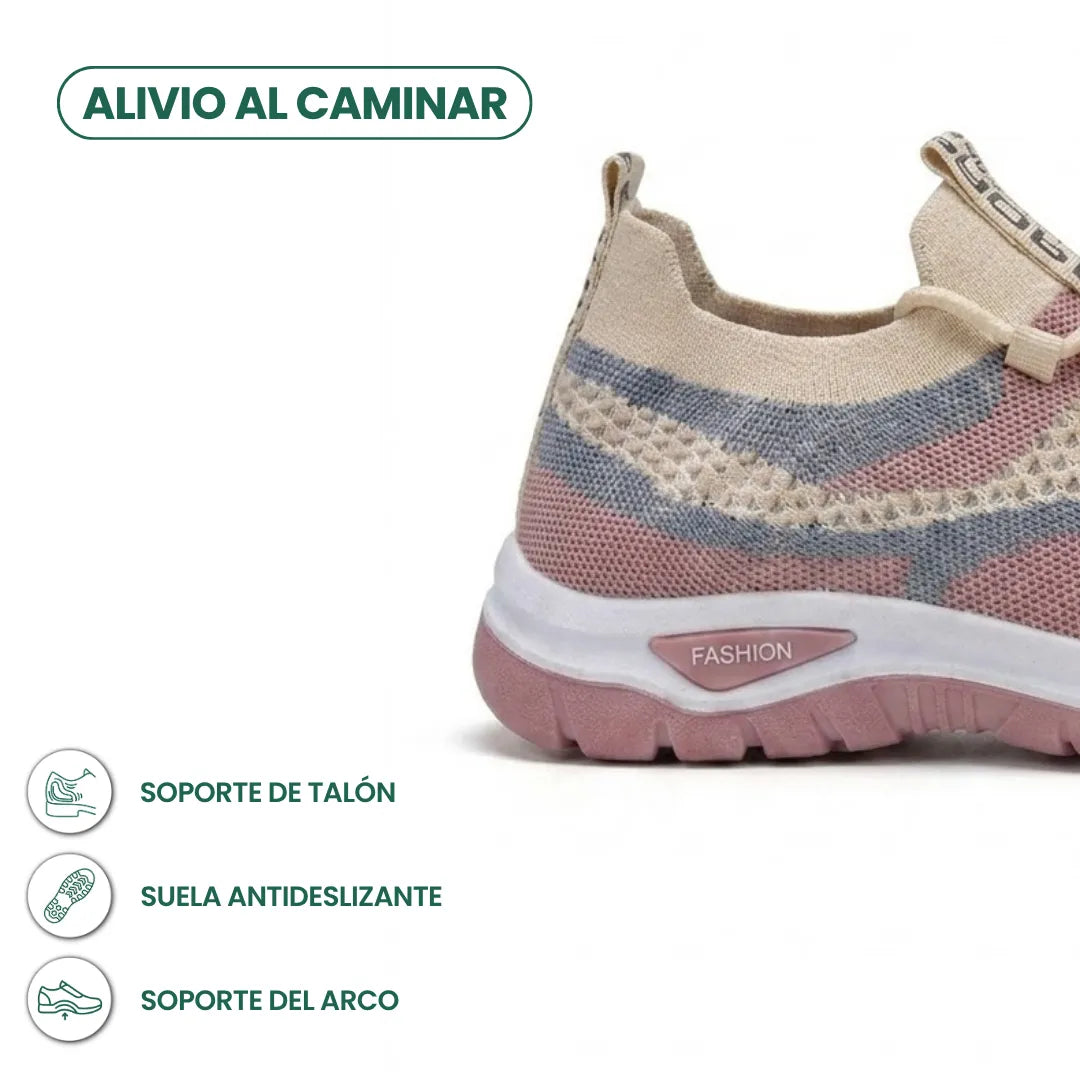 Close-up of a pink, blue and beige knit mesh sneaker heel with white midsole and treaded pink outsole, shown with comfort feature icons. 31
