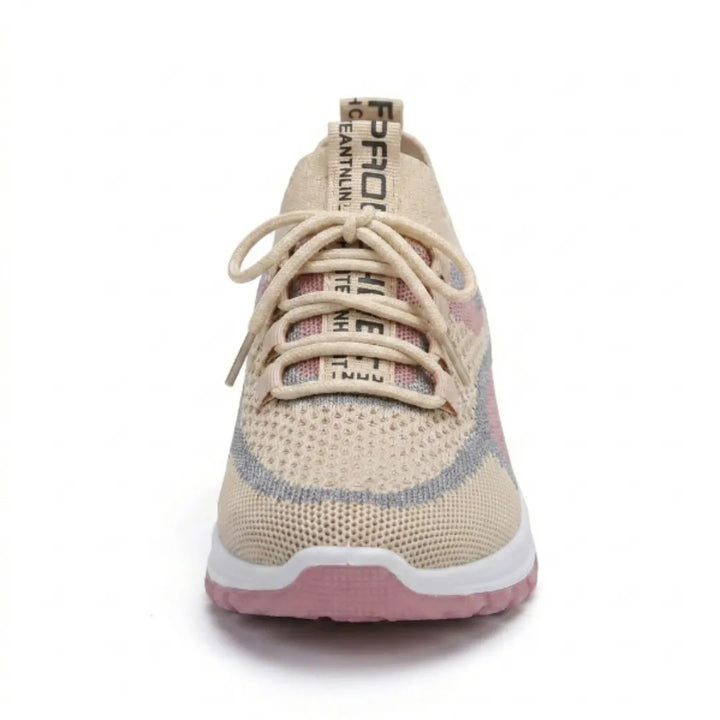 Front view of a beige knit lace-up sneaker with pink and gray accents, a pull tab at the heel and a white and pink sole. 35