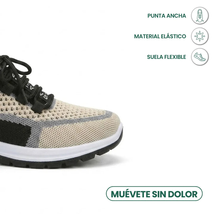 Close-up of the wide, rounded toe of a beige breathable mesh sneaker with gray trim, black laces and a white midsole. 41