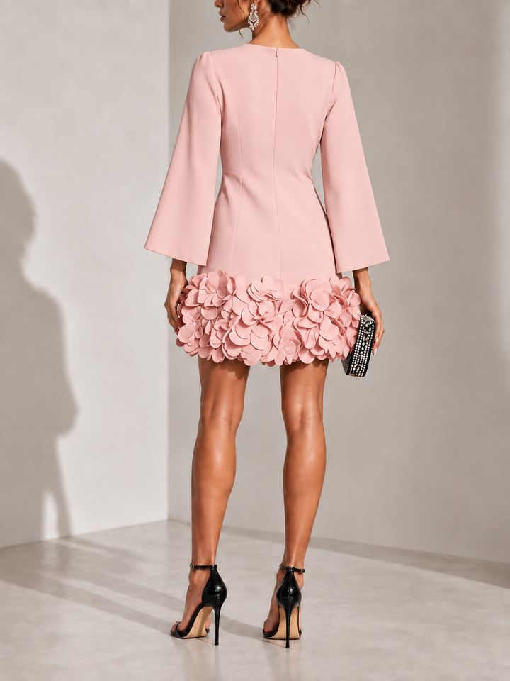 Pink dress another view showing the zipper, seamed waist and petal-covered hem.
