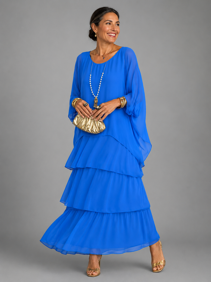 Bright cobalt blue tiered chiffon maxi dress with a layered cape top