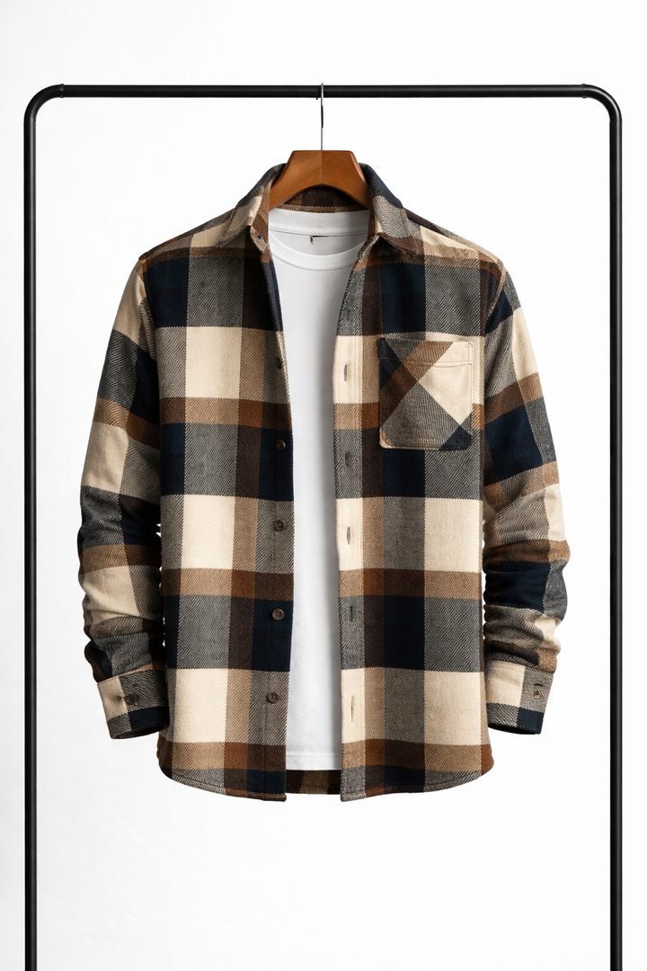 Brown, navy and beige large-check overshirt hanging open over a white tee with a chest pocket.