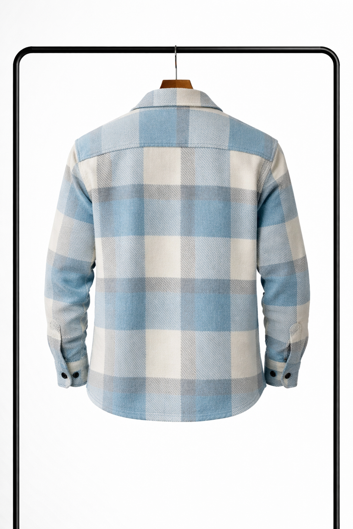 Back view of the light blue, cream and gray plaid overshirt on a hanger with buttoned cuffs.