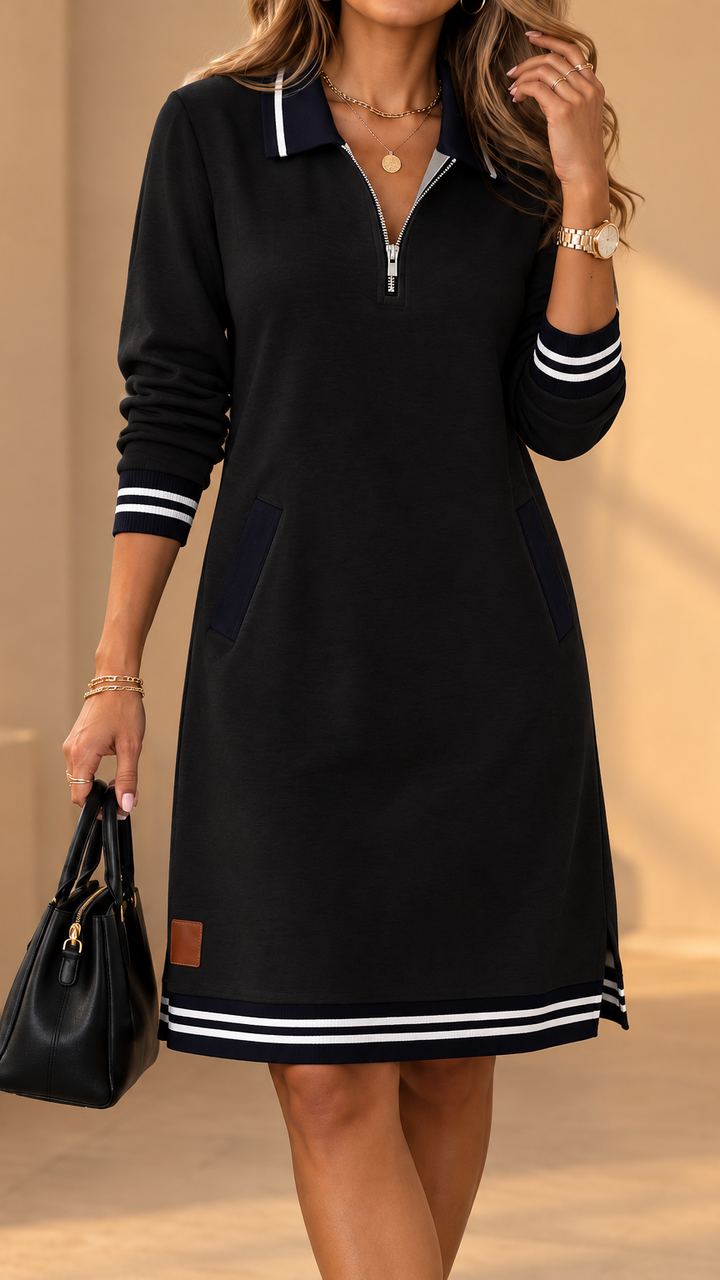 Black knee-length dress with striped collar and cuffs, zipper placket, side pockets and a small leather patch.