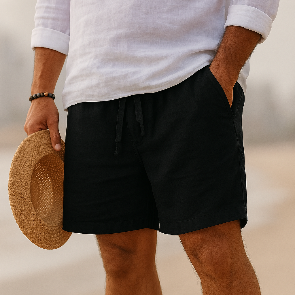Lorenzo men's cotton-linen shorts in black worn with a white shirt, detail.