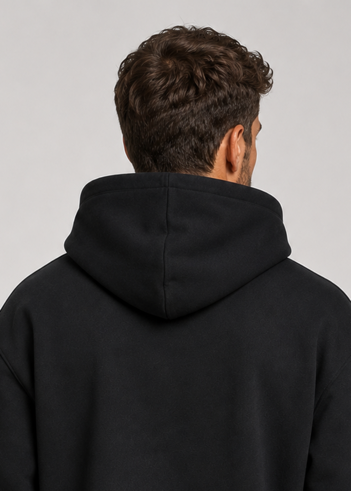 Men's black hoodie detail, back view of the hood and upper back.