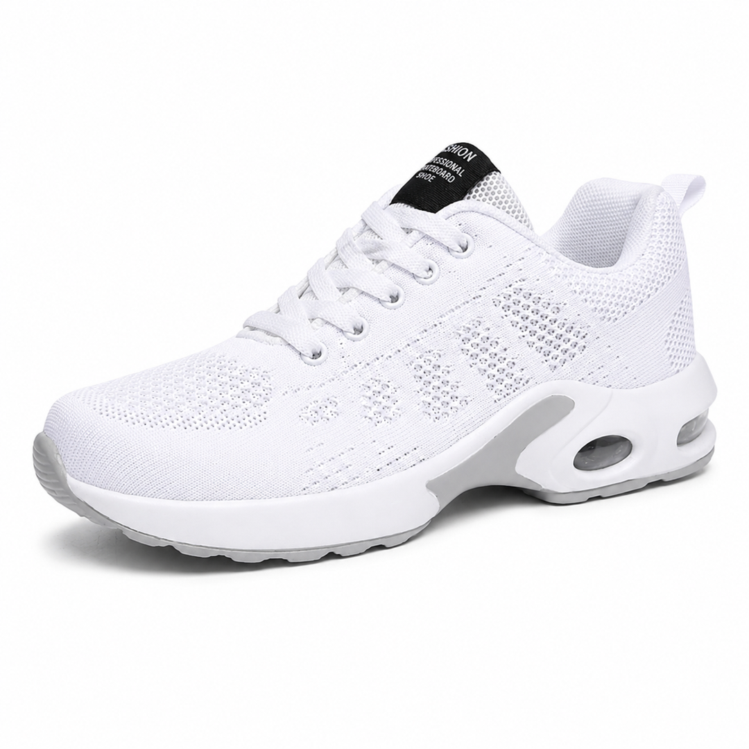 Side view of an all-white lace-up mesh sneaker with a thick white cushioned sole and a visible air window in the heel. 1