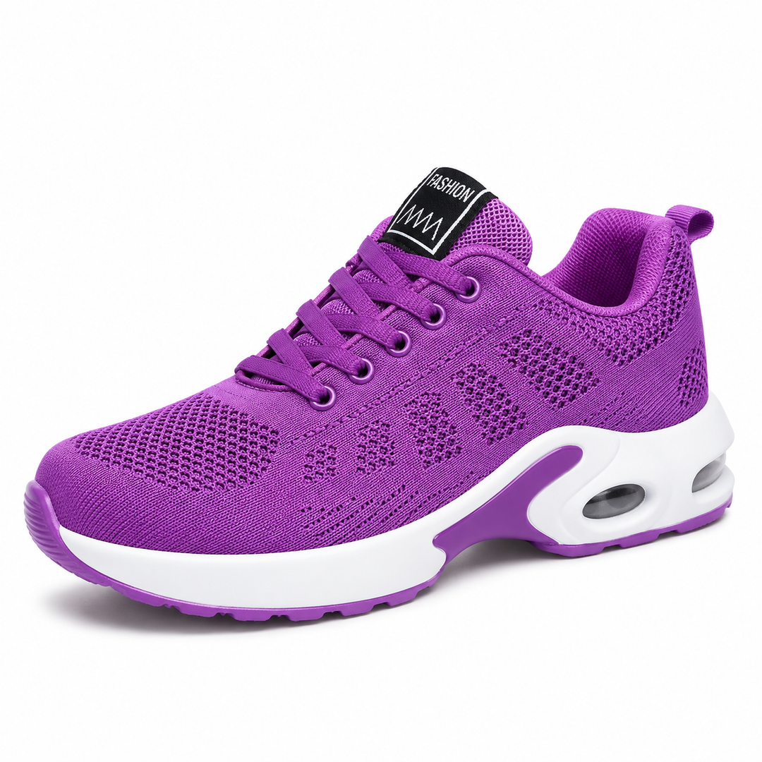 Side view of a purple mesh lace-up sneaker with a white cushioned sole and a visible air window in the heel. 4