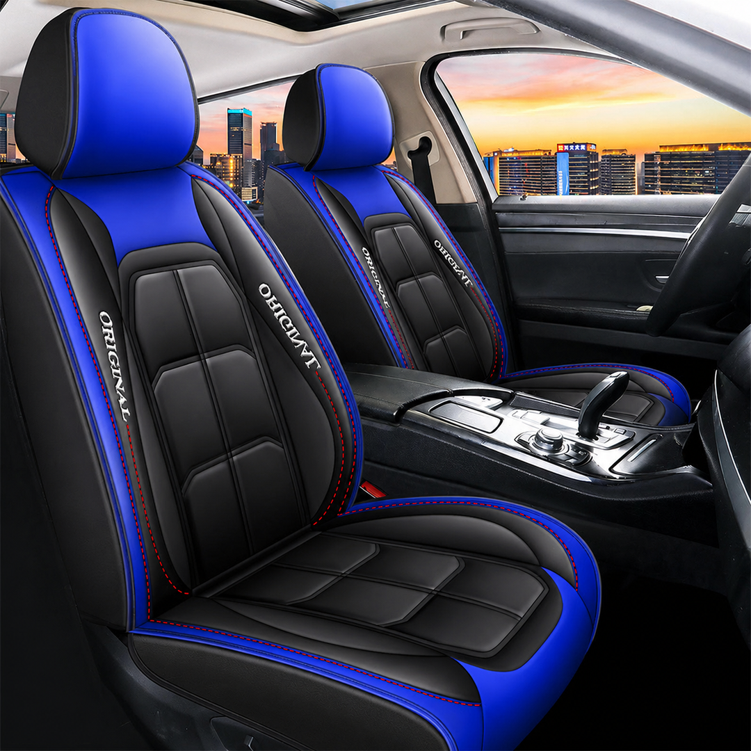 Pair of black front seat covers with blue headrests and blue side panels and red stitching in a larger car interior view.