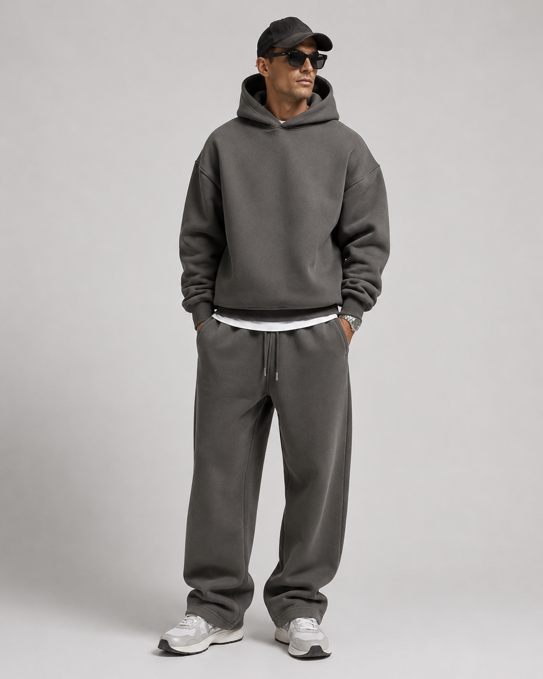 Men's charcoal gray hoodie and joggers, full-length studio view.