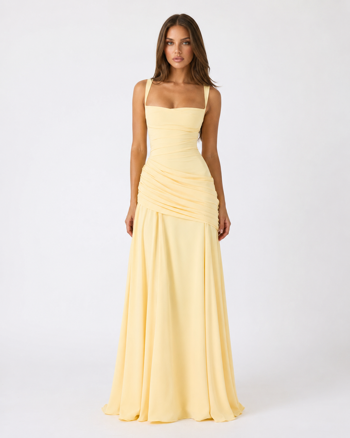 Front view of a green maxi dress with square neckline, wide straps, gathered waist drape and flowing skirt