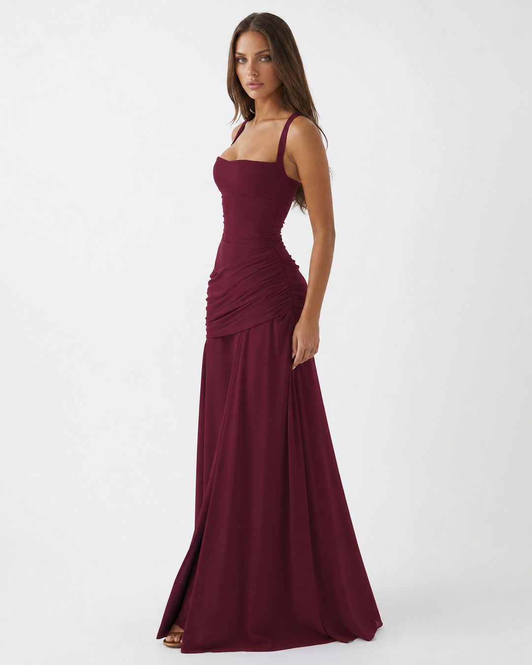 Burgundy dress in side profile, showing the fitted bodice, hip ruching and long skirt 18