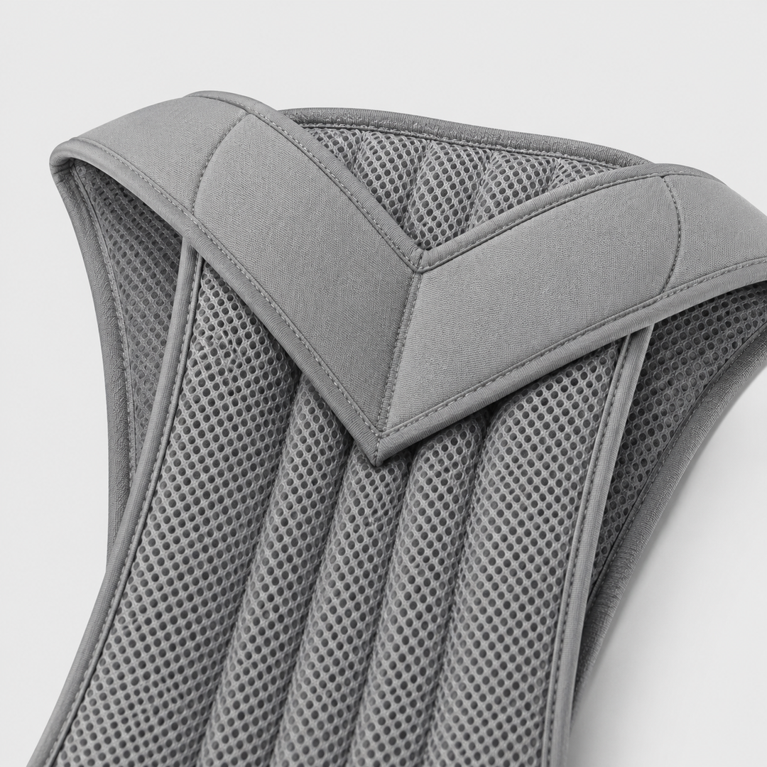 Close-up of the gray brace's padded V-shaped shoulder section and ribbed perforated mesh panel 11