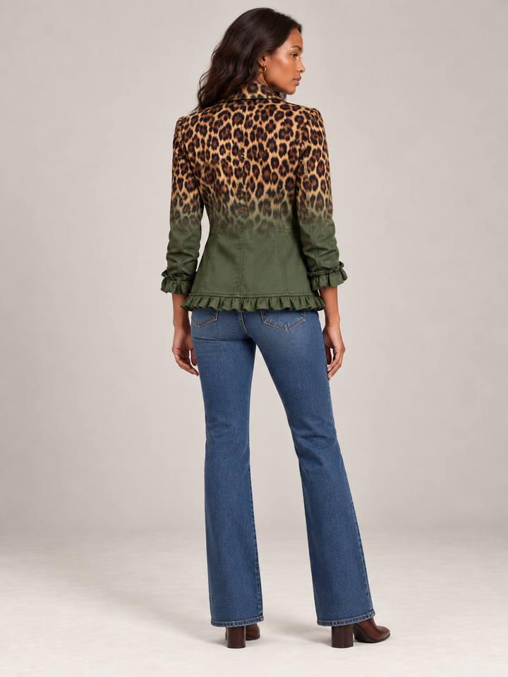 Back view of the green gradient leopard blazer showing the ruffled hem, ruffled cuffs and seamed back panels with flare jeans.