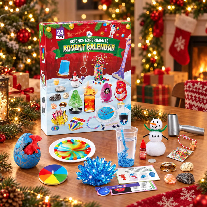 Red advent calendar box on a wooden table among Christmas lights, with experiment items like a blue crystal, hatched egg and snowman laid out in front. 1