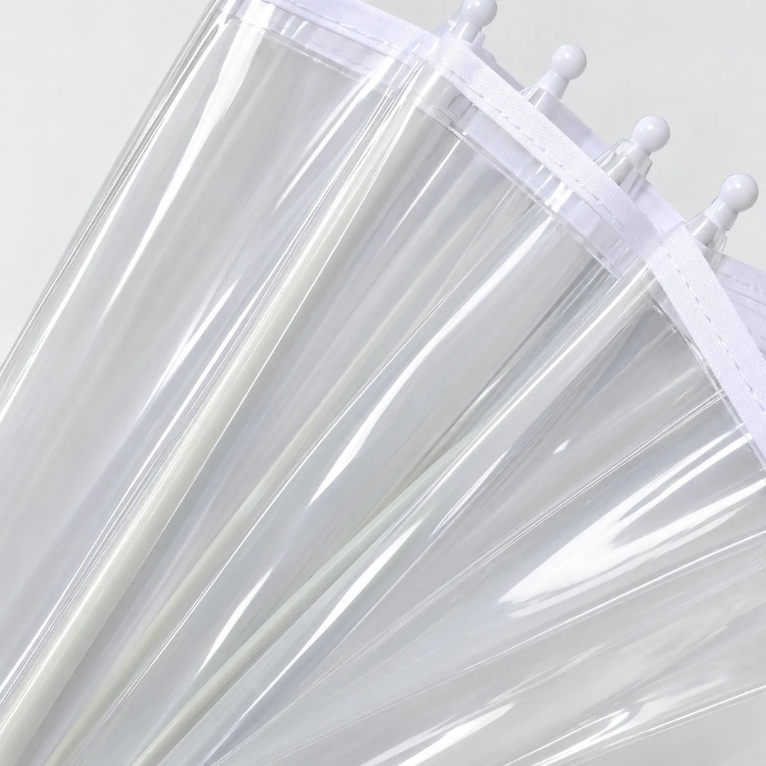 Close-up of the transparent canopy panels with white trim and rounded white rib tips along the edge. 4